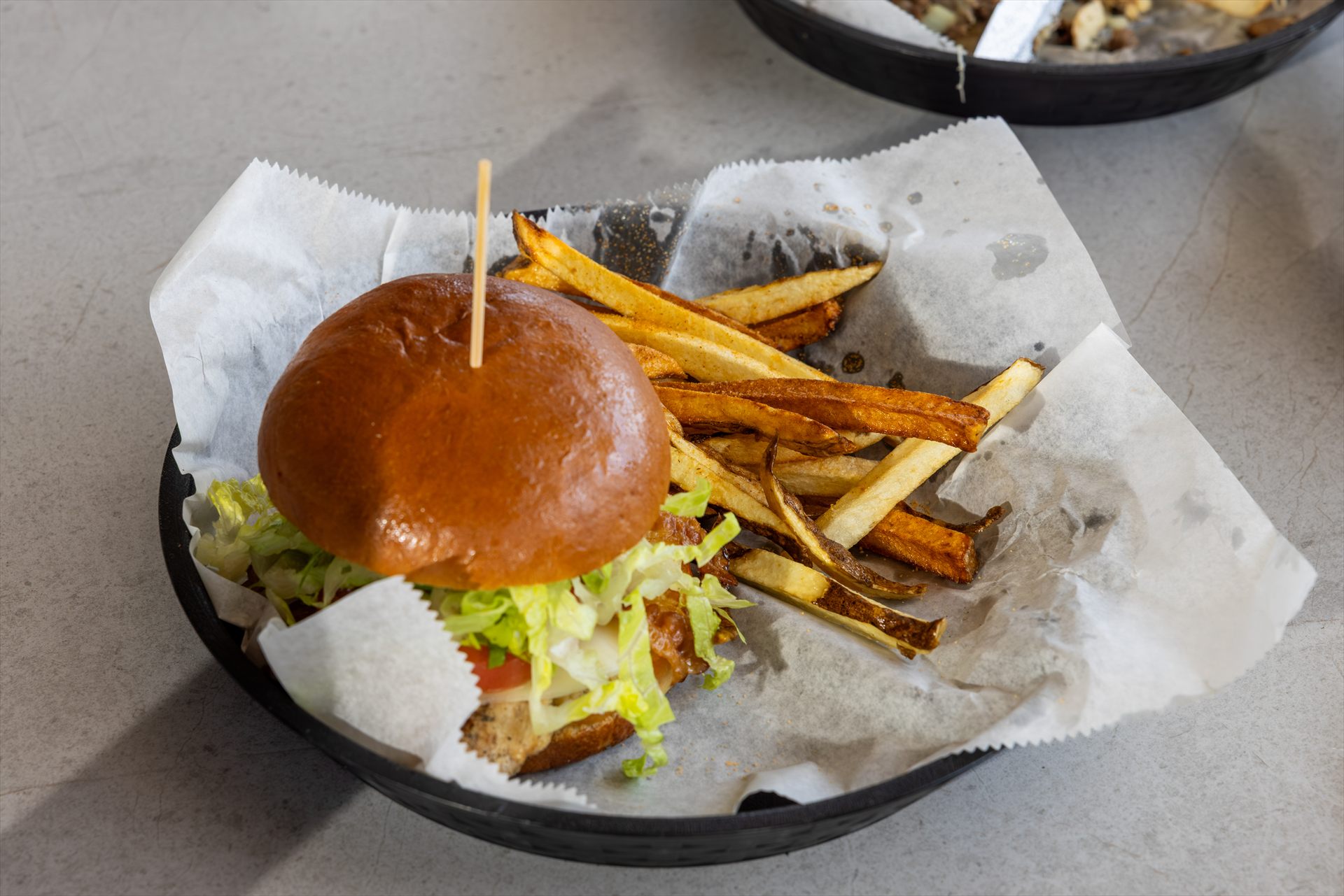 Burger and hand-cut fries served at Flip Flops