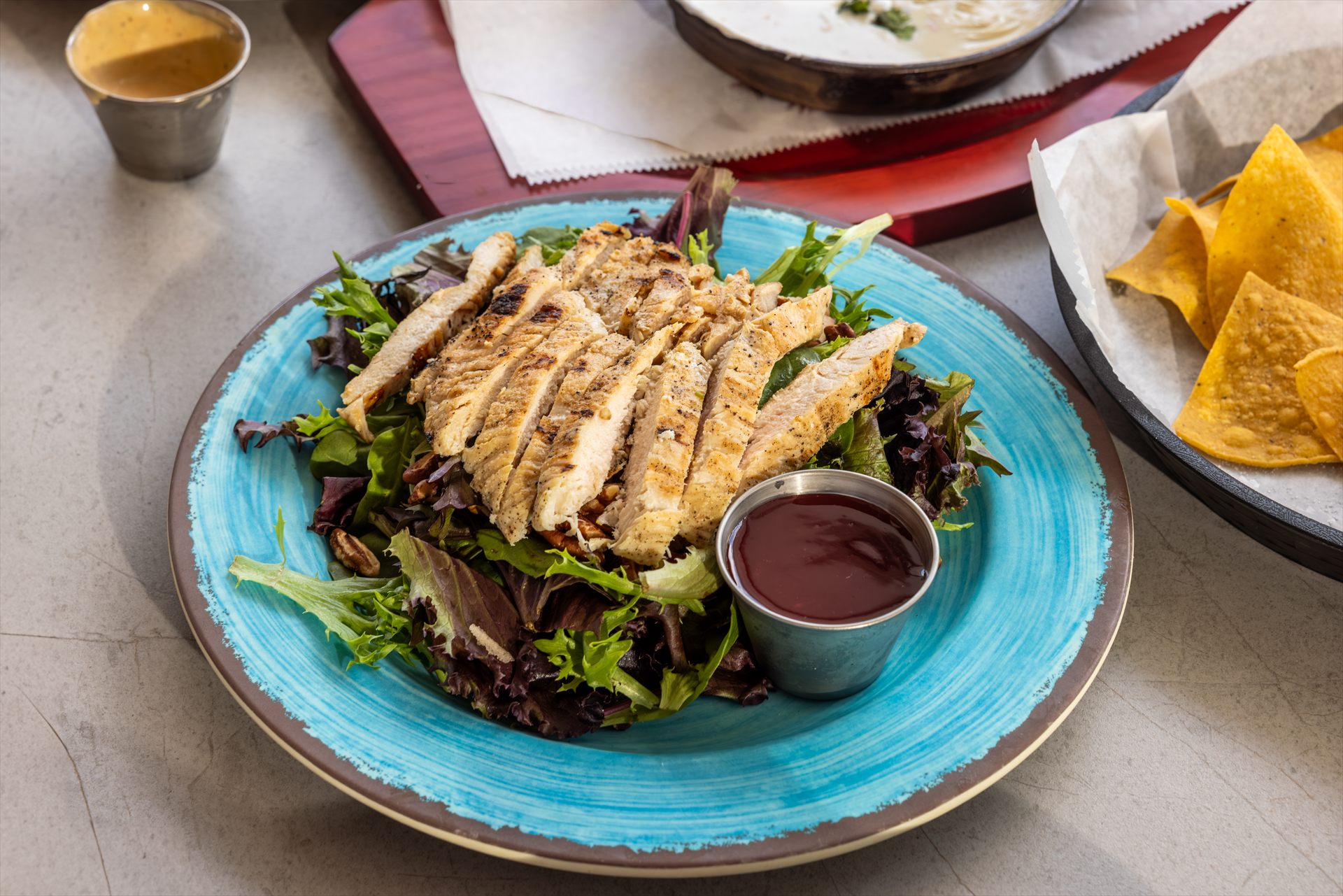 Grilled chicken salad served at Flip Flops