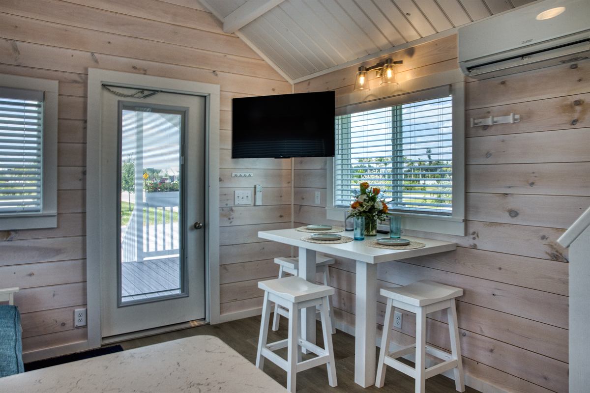 Park model dining nook with table set near windows